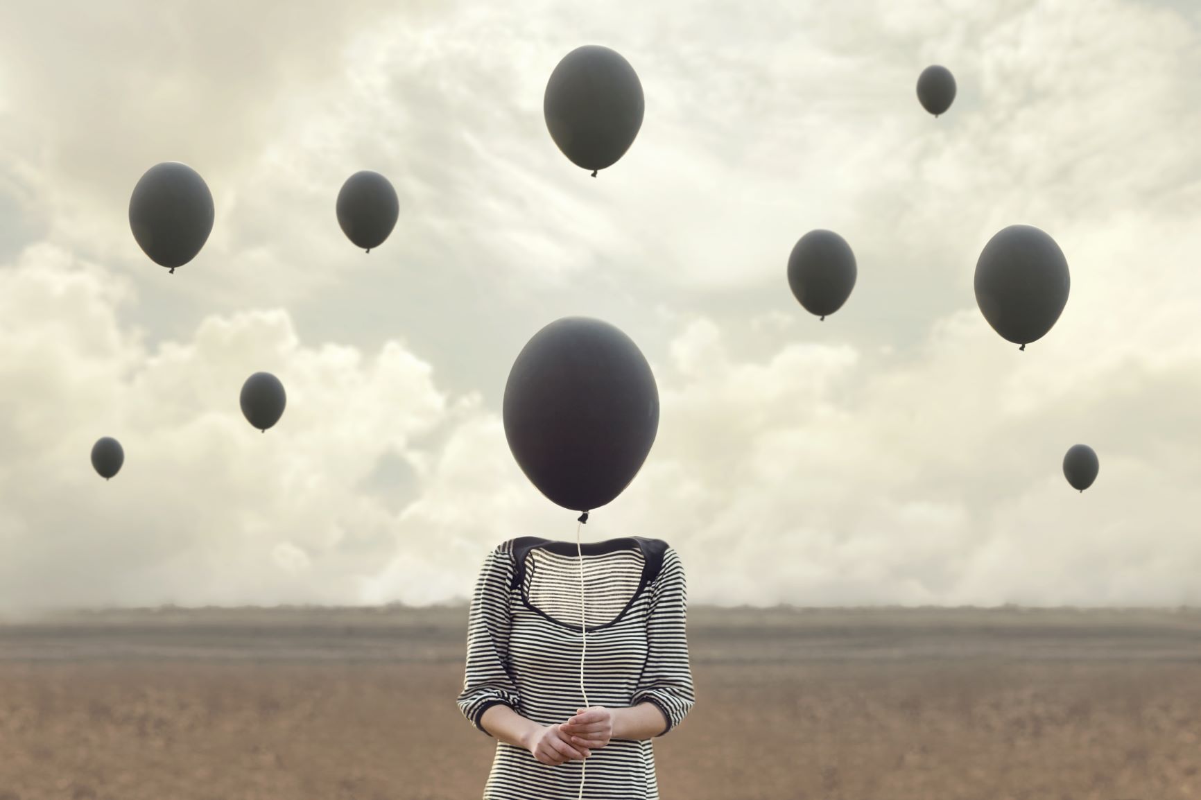 Woman with balloon for head, personal transformation